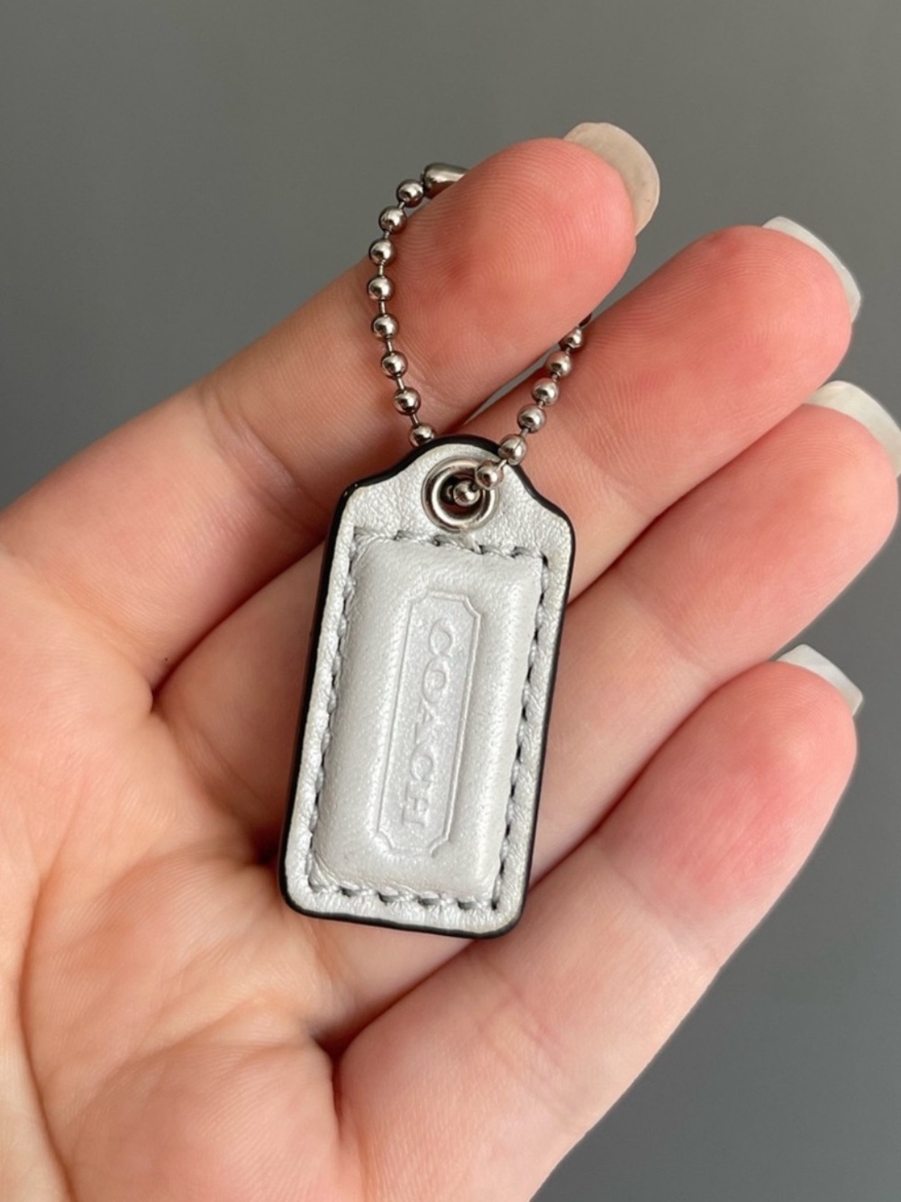 Coach hang tag